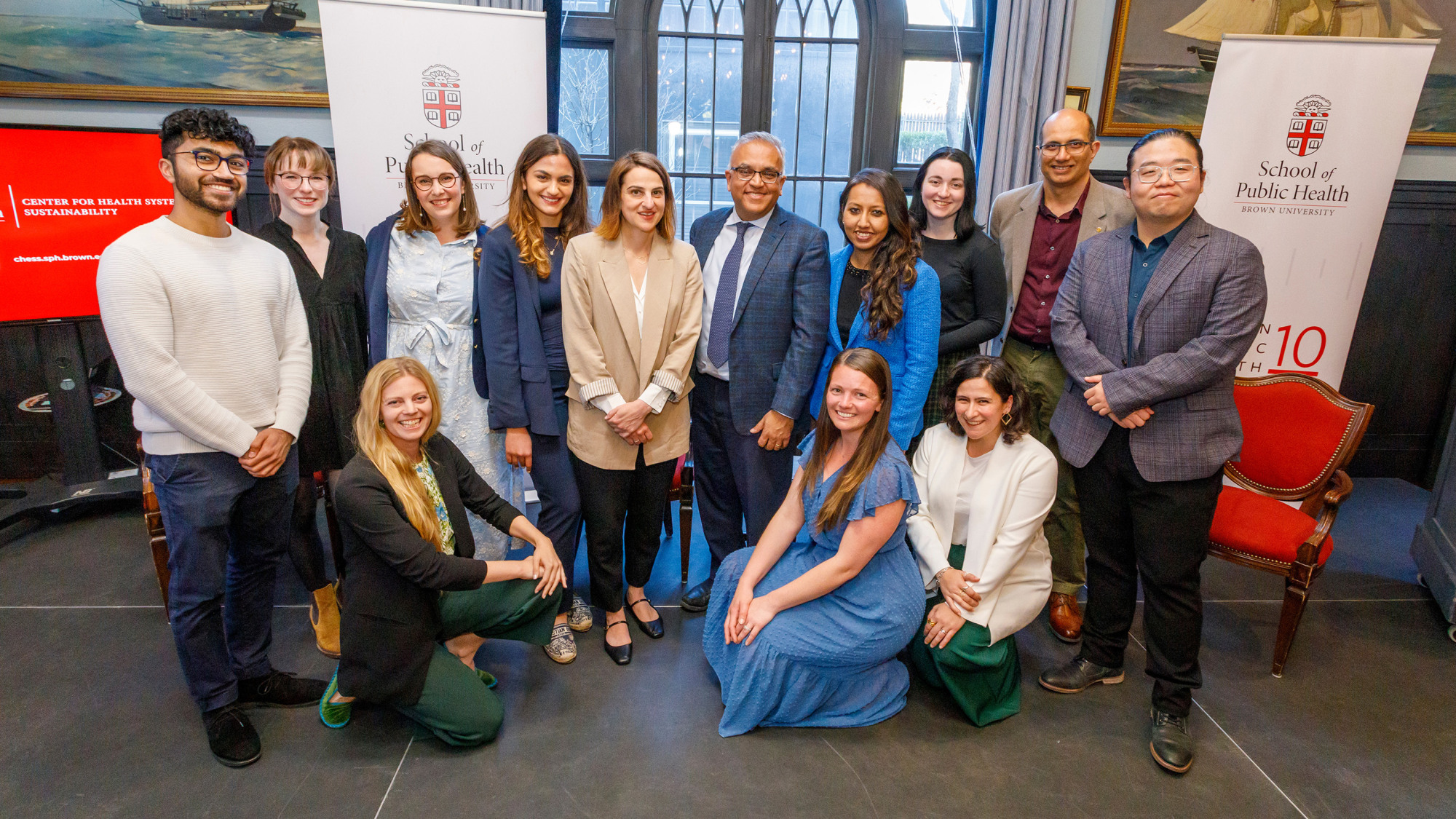 group smiles for camera at center launch event