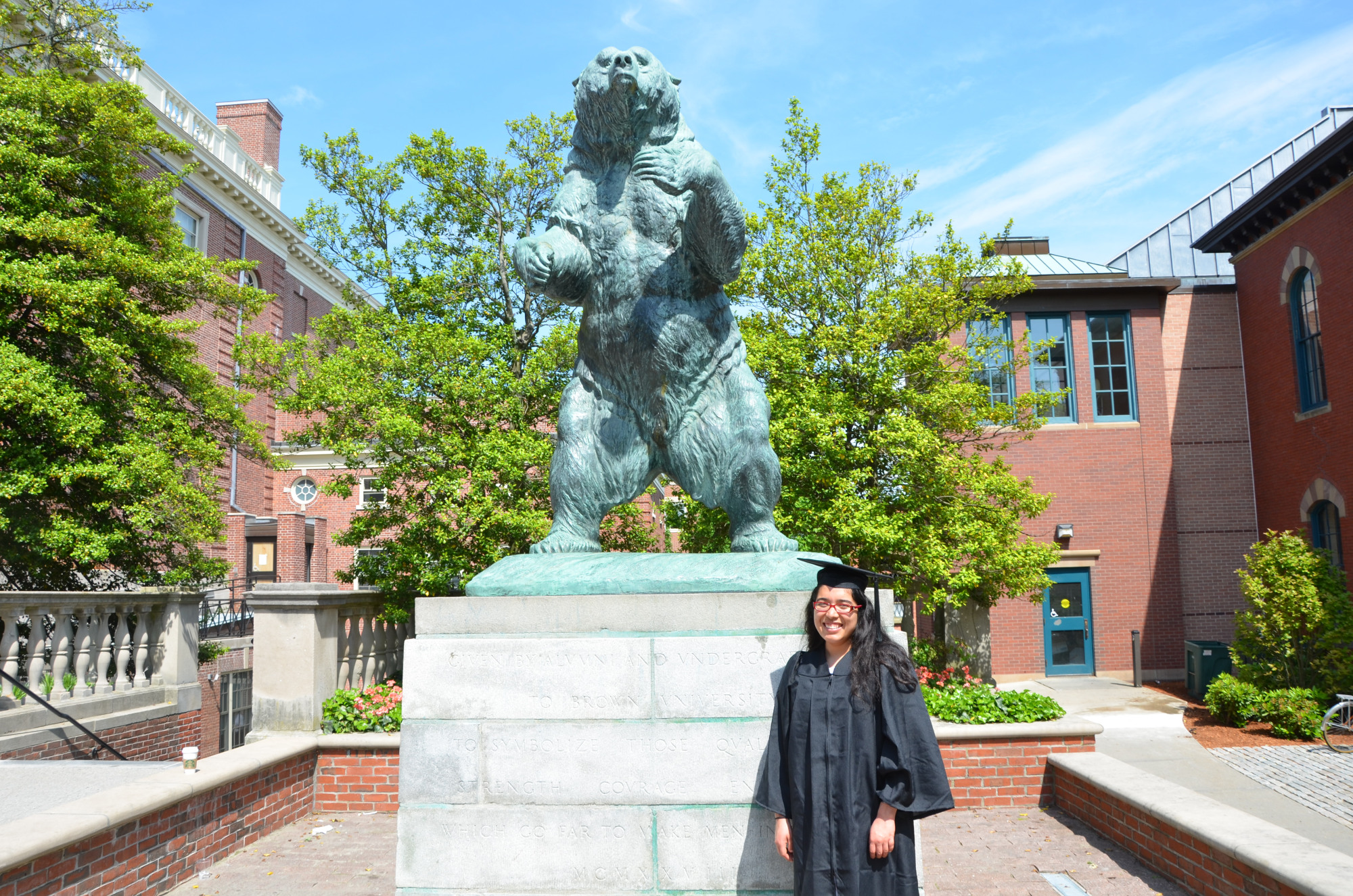 Angie Coronado poses in graduation regalia