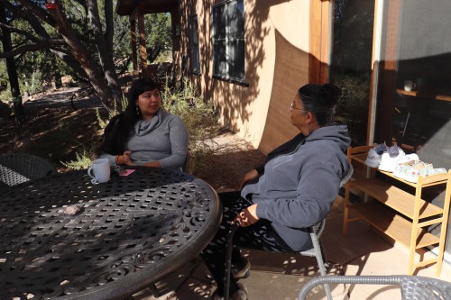 women talking at table