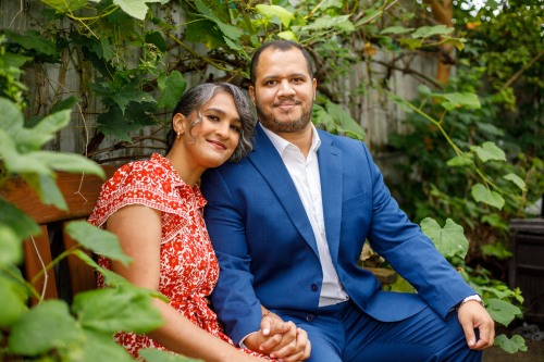 couple sits together in garden