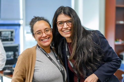 Women smile at camera