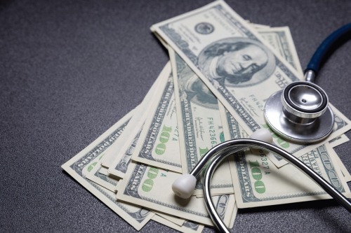 Stethoscope on money