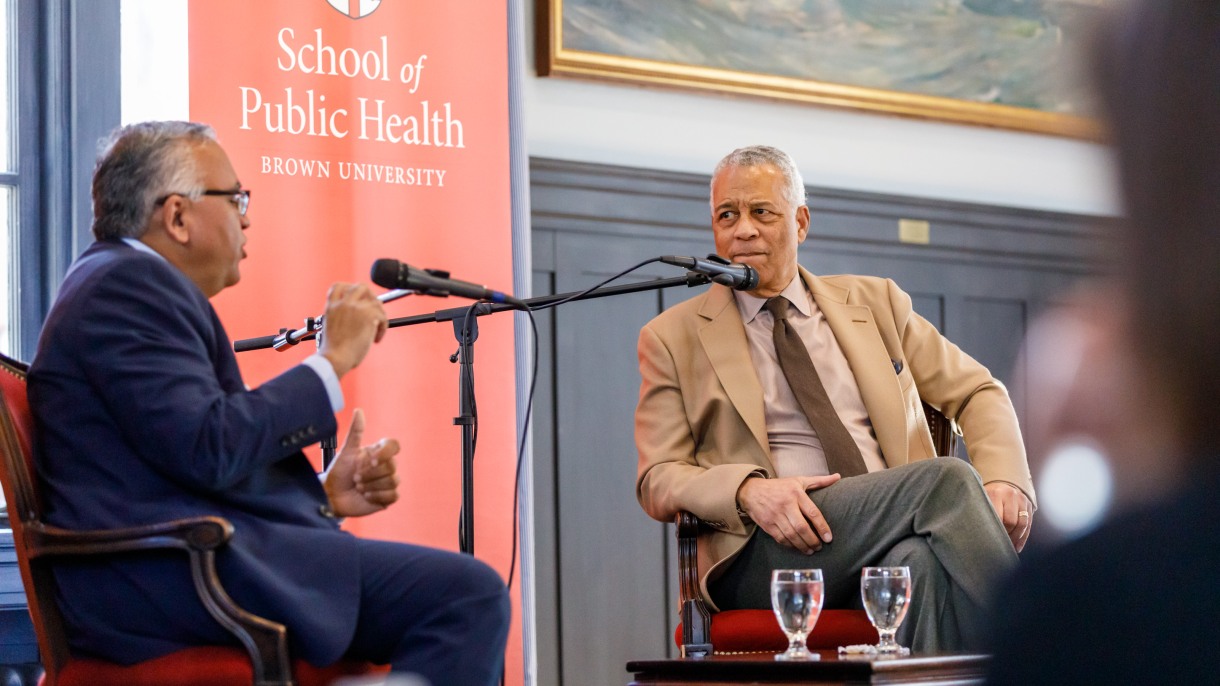 men speaking into microphones