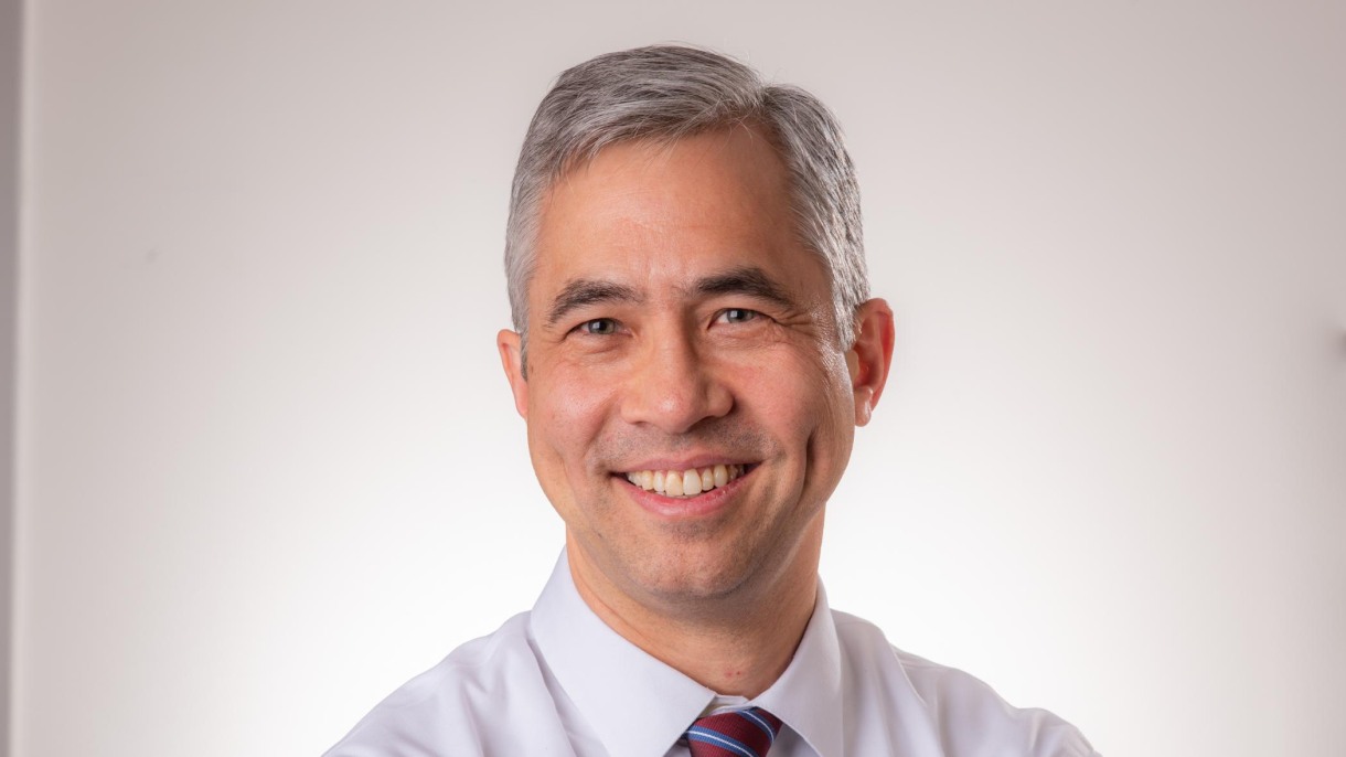 man smiles at camera