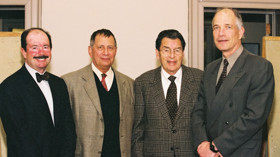 2005 Four men in suits, standing