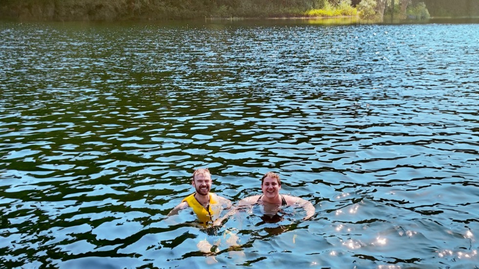 two people swimming