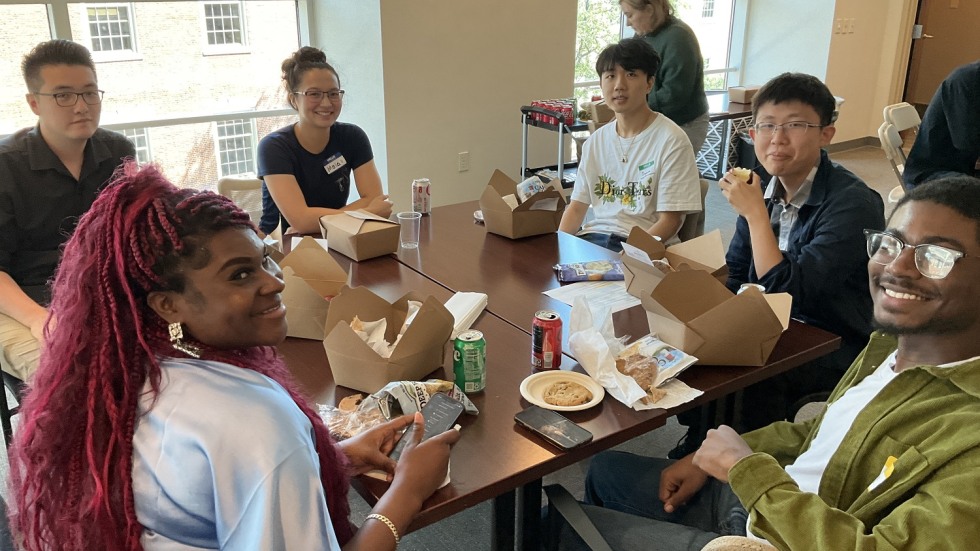 group of students eating and smiling