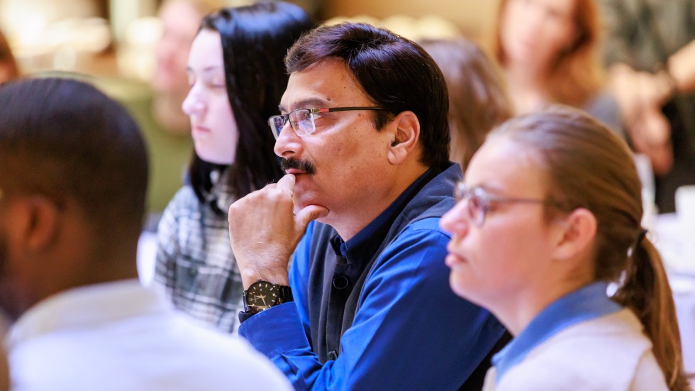 audience member looks on at the discussion