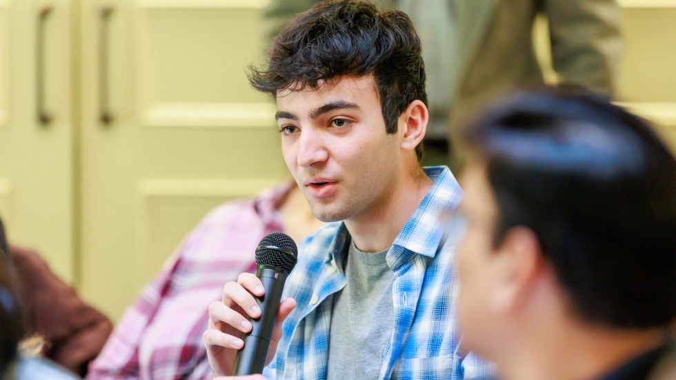 audience member speaks into microphone