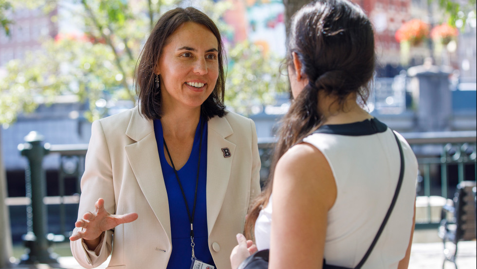 Beaudoin talking to a student